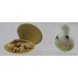 An early 20th century Japanese erotica surprise shell with pouch and a Chinese soapstone seal