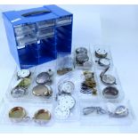 Two multi-compartment storage containers containing various pocket watch and other watch parts and