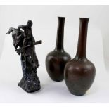 A pair of bronze WMF Ikora vases of onion shape,