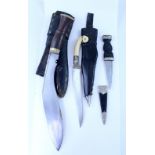 Three vintage ceremonial daggers including a 19th century Middle Eastern Janbiya with ivory handle,