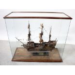 A scratch-built model three-masted ship, 'Golden Hind', on wooden base in glazed display case,