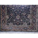 A large contemporary machine made woollen carpet with floral design, 270 x 185cm.