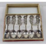 A set of six Chinese Woo Shing 900 grade silver teaspoons with Chinese script within panels to the