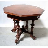 A mahogany octagonal table with inset painted geometric design to top,