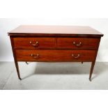 An Edwardian mahogany inlaid three-drawer chest, two short drawers over one long drawer,