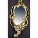 An early 20th century Rococo-style gilt wall mirror, height 145cm (af).