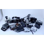 A quantity of modern and vintage cameras and lenses to include Mamiya MC1000s, Yashica FX-D,