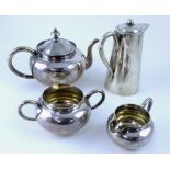 A Chinese hallmarked silver four-piece tea service comprising teapot, hot water jug,