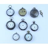 A mixed group of eight small pocket watches of various sizes and types, some silver cases,