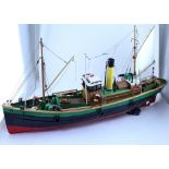 A modern scratch-built wooden model of a steam fishing boat, the deck fitted with figures, nets,