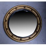 A reproduction gilt-framed convex wall mirror, diameter 45cm.