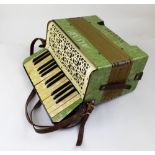 ALVARI; a faux green veneered mother of pearl detailed piano accordion,