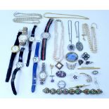 A mixed group of costume jewellery to include necklaces, fashion watches, brooches etc.