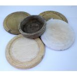 Four vintage circular bread boards,