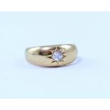 An 18ct gold signet ring inset diamond in a star-form ground, stamped 18, size I, approx 5.0g.