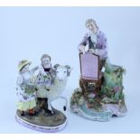 A 19th century Continental porcelain figure group depicting a small child riding a ram with another