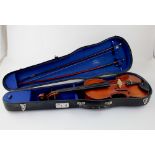 A full size violin bearing paper label 'Nachahmung Von Maggini Fecit Anno' and two violin bows,