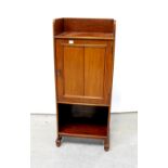An Edwardian mahogany smoker's cabinet with three-quarter galleried top above single panelled door