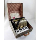 A Hohner Student VM, forty-eight key piano accordion in travel case.