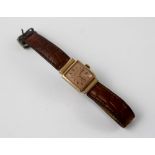 A Bulova ladies' watch, 14k gold filled, on leather strap.