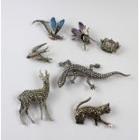 Six various marcasite brooches and one other steel cut examples (7).