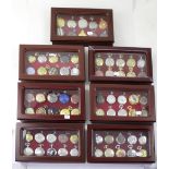 A large collection of modern collectible pocket watches within seven wooden display cases (70).