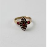 An Edwardian 9ct gold dress ring set with garnets, seed pearls and diamond chips, size I, approx 1.