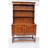 A reproduction stained oak dresser,
