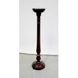 An Edwardian inlaid mahogany jardinière stand with square top on tapering legs,