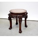 An Oriental jardinière stand with inset rouge marble panel and a mahogany tripod occasional table