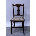 An Edwardian inlaid mahogany bedroom chair with pierced splat back,