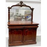 A Victorian flame mahogany mirror-back sideboard with arched plate above two cushion drawers,