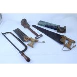 A mixed lot of vintage tools to include grease guns, hand drills, saws,