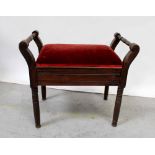 An Edwardian stained beech piano stool with upholstered lift-up seat, width 58cm.