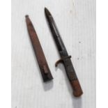 A WWII short bladed parade bayonet. CONDITION REPORT In poor condition.