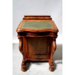 A reproduction walnut Davenport with upper stationery compartment with hinged lid above gilt-tooled