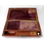A Victorian mahogany and brass bound writing slope with fitted interior, pen tray and inkwell,