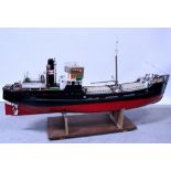 A remote control scratch-built wooden model cargo ship, the deck fitted with lifeboats,