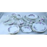 A Wedgwood part tea and dinner service in the 'Devon Sprays' pattern comprising dinner plates, cups,