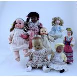 Twelve Antique and vintage dolls of small size to include an Armand Marseille example, P1.214.