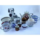 A box containing Victorian pottery including Staffordshire spaniel, Doulton mug,
