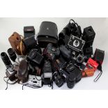A collection of modern and vintage cameras to include Minolta, Nikon, Dell Monta, Ilford,