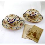 A pair of Sèvres porcelain covered tureens on stands,