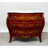 A Louis XV style parquetry veneered and satinwood inlaid bombé-fronted commode with three drawers,