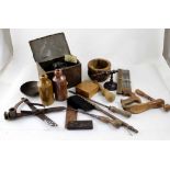 A box containing vintage tools, stoneware bottles, vintage clippers etc.