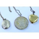 Two yellow metal lockets,