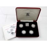 A 1984-1987 United Kingdom £1 silver proof collection, in 'The Royal Mint Presentation Pack'.