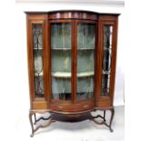 An Edwardian inlaid mahogany bow-fronted display cabinet inlaid with satinwood swags,