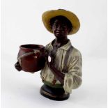 A painted plaster figure of a male wearing a straw hat, impressed marks to the underside,