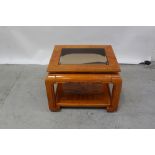 A modern Chinese-style yew wood side table of square form with glass top, width 75cm.